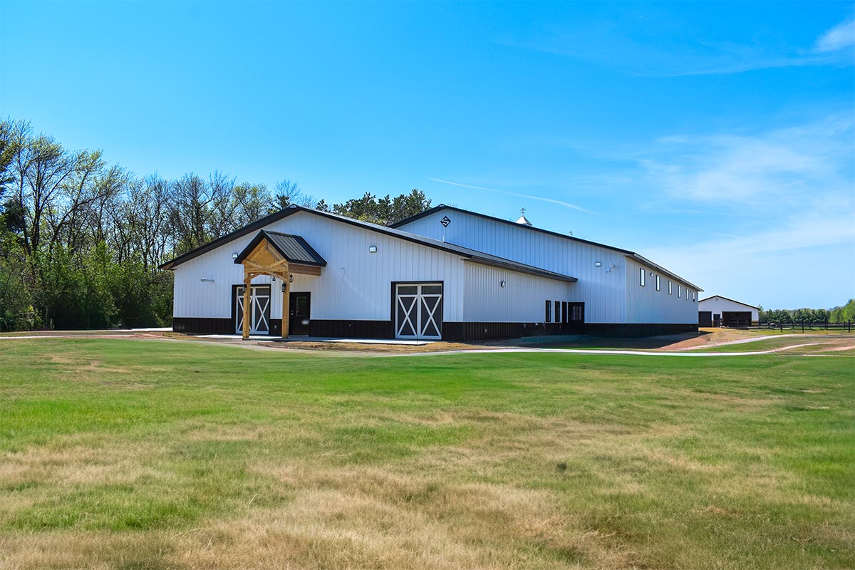 Thomasburg Equestrian Facility Frederic WI Post Frame Riding Arena Grass 24
